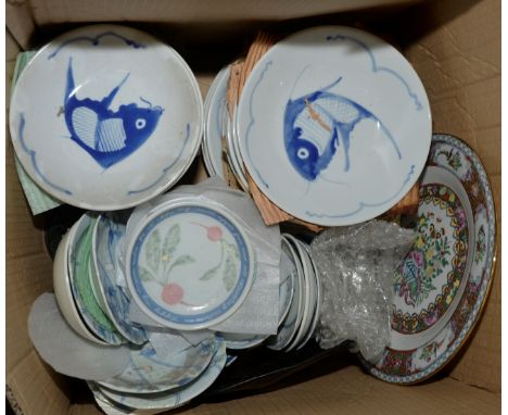 Box of Oriental dishes with fish decoration, saucers etc.