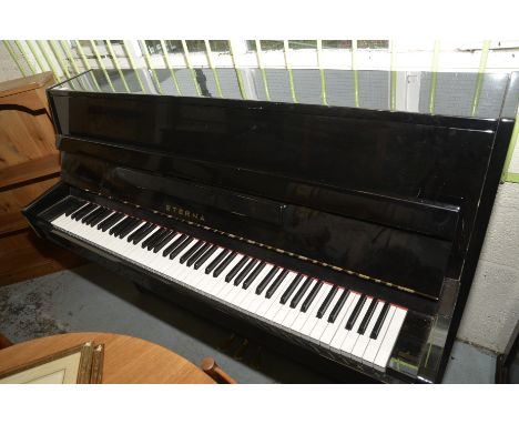 Black lacquered cased overstrung Eterna piano