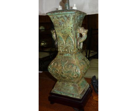 A bronzed Chinese style label lamp