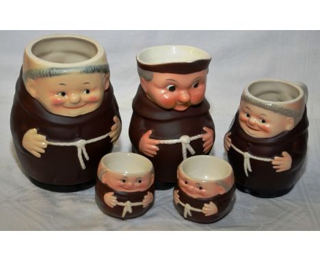 Three Goebel monk tankards and a pair of Goebel monk egg cups