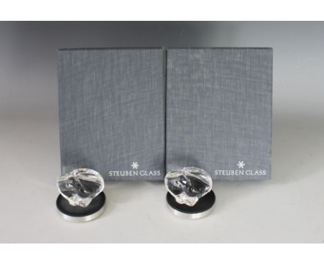 Two Steuben glass models of eagles, each 5.5cm high, upon chromed pedestals and within original boxes with papers (2)