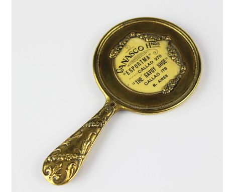 A brass mounted advertising miniature hand mirror, inset with 'Vanasco Honos The Savoy Shoe Buenos Aires', 9.5cm long