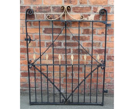 A wrought iron gate, with scroll detailing, 125cm x 37cm