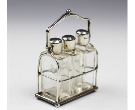 A George V set of three silver topped miniature perfume bottles, M & C Lister Ltd, Birmingham 1911, each rectangular glass pe