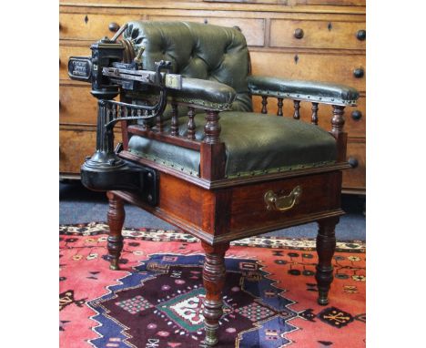A late Victorian jockey scales / weighing chair by W & T Avery of Birmingham, with button back green leather upholstery on an