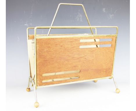 A vintage bound steamer trunk, 33cm H x 92cm W x 54cm D (at fault), containing a 1970's magazine rack and a two division wire