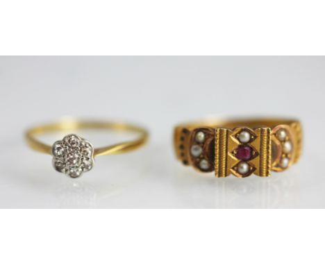 Two rings, to include; A diamond set daisy cluster ring, hoop stamped '18ct PLAT', weight 1.5gms and a 15ct gold ruby and pea