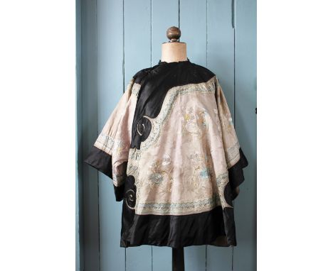 A Chinese silk embroidered ladies jacket, late 19th century, embroidered throughout with silk threads depicting floral sprays