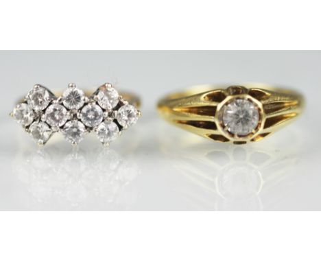 A ten stone dress ring, designed as three rows of colourless stones (probably CZ) all set in yellow and white metal, stamped 