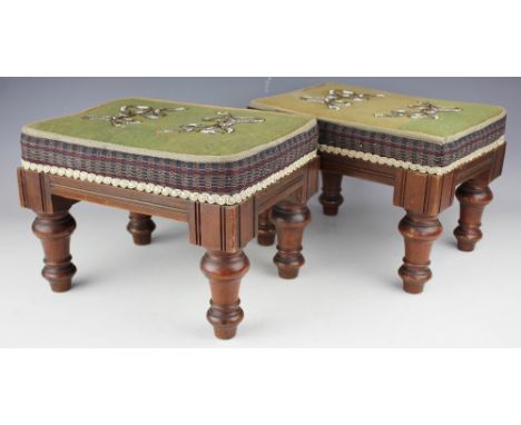 A pair of Victorian walnut foot stools, each rectangular stool with beaded bow detailing, on turned legs, 22.5cm H