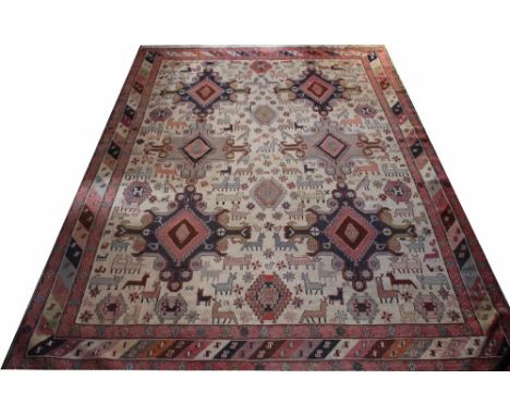 A Caucasian hand woven wool carpet, worked with a pattern of six medallions and animals against a cream ground, 298cm x 206cm