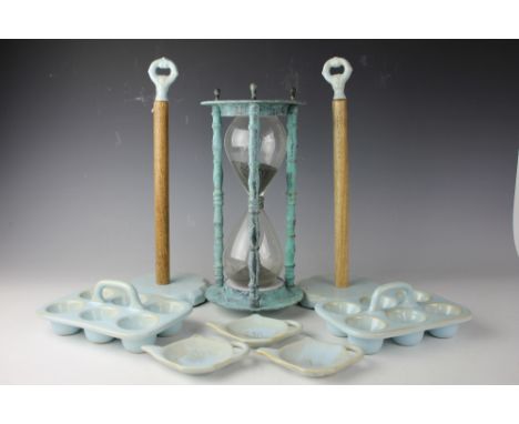A large contemporary kitchen egg timer, two celadon glazed kitchen roll holders, along with two ceramic blue glazed six divis