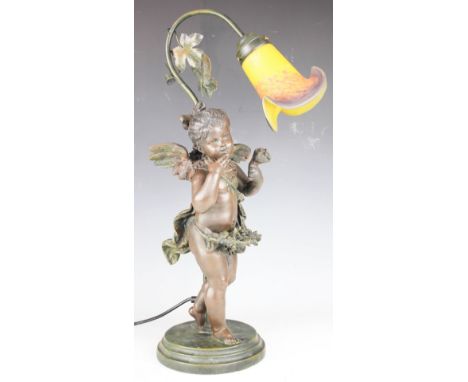 An Art Nouveau style bronzed table lamp, modelled as a cherub, with mottled glass shade, (wing at fault), 59cm, with a modern