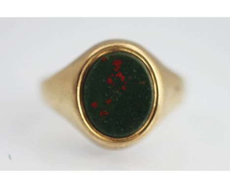 A gents bloodstone set signet ring, of oval form, all set in 9ct yellow gold, weight 6.3gms   