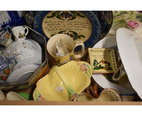 An assortment of ceramics including six items of Torquay Motto ware, a Royal Winton 'Grimwades Pixie' cream jug, a yellow Cro