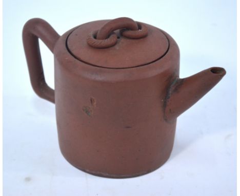 A Yixing teapot and cover with loose-ring handle finial; of cylindrical form, the base and cover both with seal mark, 11cm hi