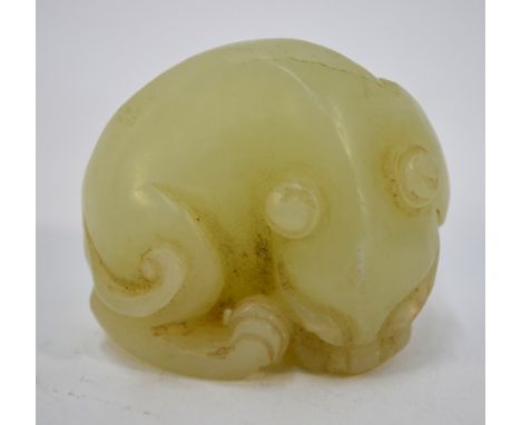 A small green jade of a recumbent, curled lion dog or other mythological animal, 4cm wide, post Qing Dynasty   Condition Repo