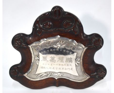 An historical, hardwood mounted, white metal memorial plaque presented to the Famous Aviatrix, The Hon. Mrs Victor Bruce F.R.