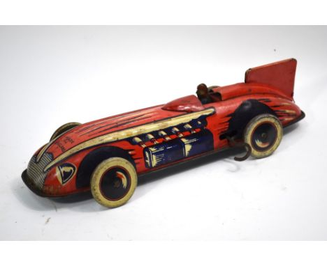 A Wells Brimtoy clockwork tinplate racing car in red, 28 cm   Condition Report  Played with, motor working, minor dents and w
