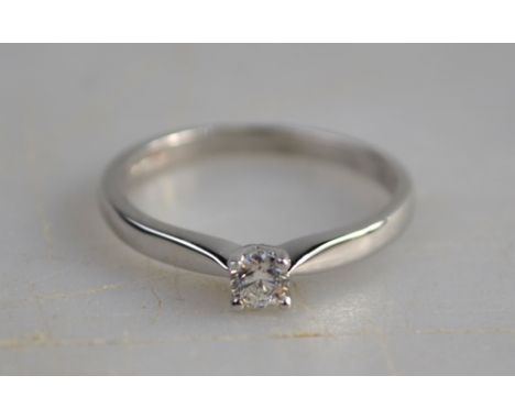 A single stone brilliant cut diamond ring 18ct white gold four claw setting, size M 1/2