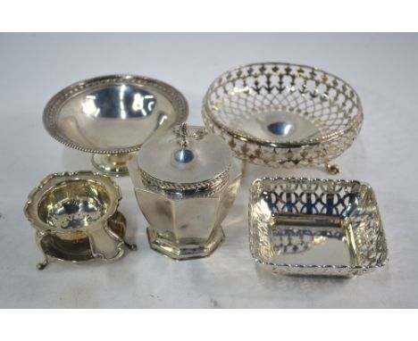 A pierced silver bonbon dish on pad feet, Birmingham 1929, to/w a small stemmed dish, Sheffield 1905, a square pierced bowl, 