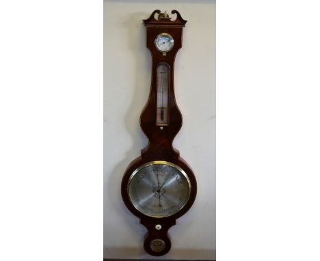 An early 19th century flame mahogany wheel barometer with silvered thermometer scale, 25 cm main dial and spirit level, by C 