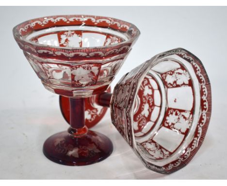 A pair of 19th century Bohemian ruby flash glass comports with faceted bowls, raised on plain stems with a blade knop and dom