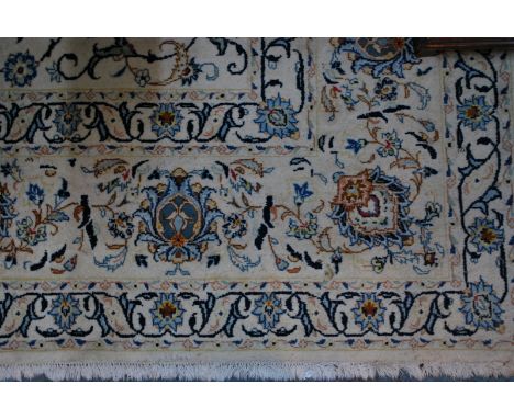 A large Persian Nian carpet, the flowering vine design on traditional off white/camel ground, 386 x 260 cm   Condition Report