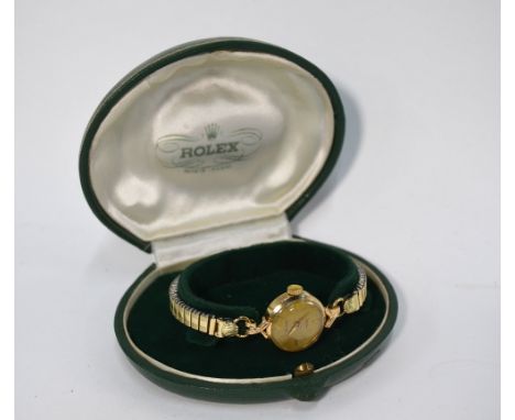 A lady's 9ct gold Rolex Precision wristwatch, the champagne dial with gilt batons, 17-ruby movement, on expanding gilt 'Fixo-