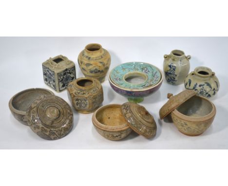 Three Thai Sawankhalok ceramic boxes, each one with a matching domed cover, the largest 10 cm diameter, together with a jar o