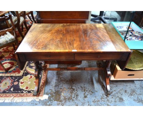 A Regency cross-banded figured mahogany sofa table, the rectangular top with rounded drop ends over a pair of frieze drawers 