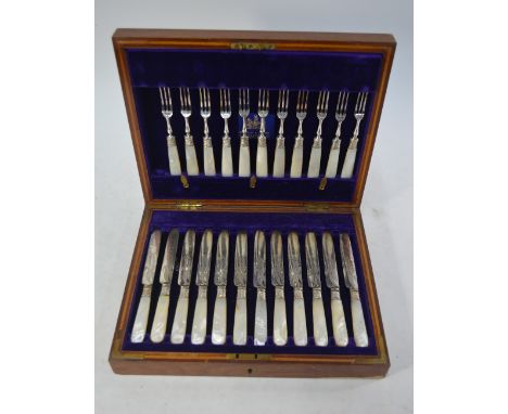 An oak-cased set of twelve Mappin & Webb Prince's Plate dessert knives and forks with mother-of-pearl handles