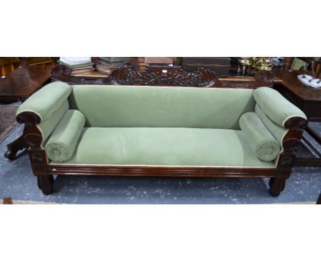 A Regency mahogany framed sofa with pale green upholstery, raised on moulded front legs, 201 cm wide