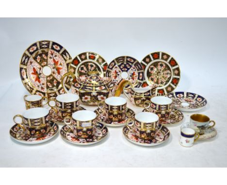 A number of Royal Crown Derby, Imari pattern wares, comprising: a teapot and milk jug; 7 cups (one cup with three handles); a