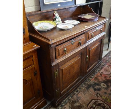 An 18th century oak North Country low dresser with raised shelf above two short and two long drawers, 117 cm wide