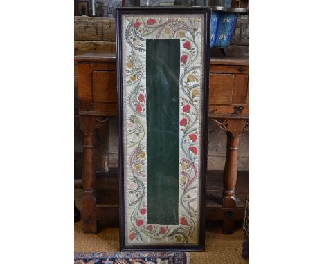 An Indo-Persian (or other Asian) rectangular textile, decorated with a formal floral design, framed and glazed, overall dimen