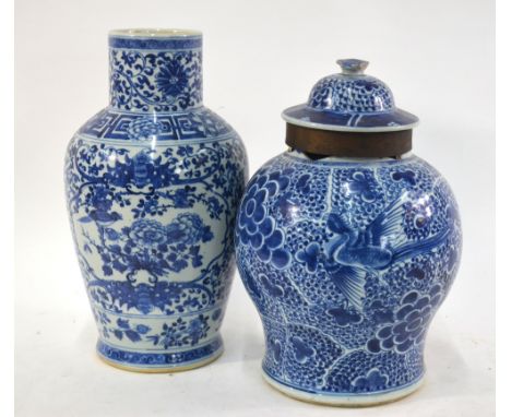 Two Chinese blue and white vases: one decorated with panels depicting birds perched beside peony, 34cm high, late Qing Dynast