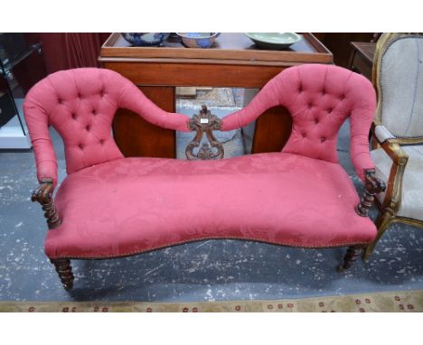 A moulded mahogany framed chair back sofa over a serpentine form seat, raised on spiral twist turned front legs to brass cast