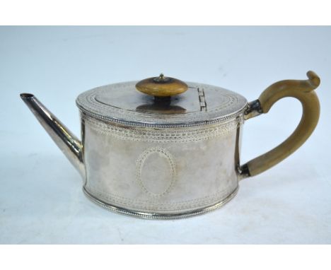 A George III silver bachelor teapot of eliptical form, with nail-engraved decoration, Thomas Daniel, London 1783   Condition 