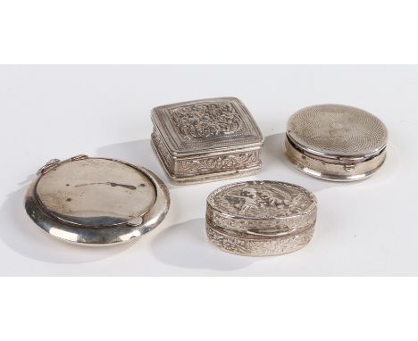 Sterling silver pill box, of oval form, embossed with cherubs, stamped and engraved to the bottom, together with a white meta