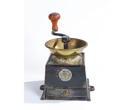 A 19th century cast iron and gilt pressed copper coffee grinder, by Archibald Kenrick and Sons Limited, West Bromwich with tu