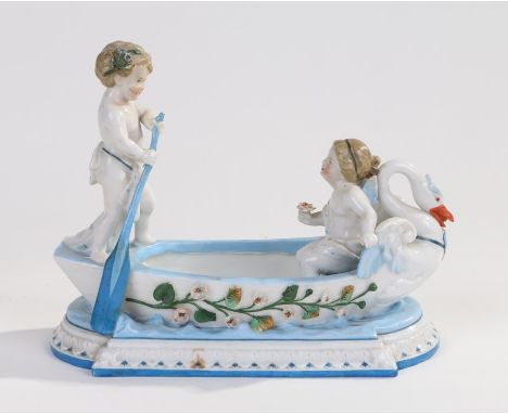 KPM Berlin porcelain table centre piece, in the form of two cherubs in a boat, blue stamp mark to base, 20cm long