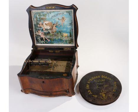 Late Victorian Polyphon music box, the shaped walnut box with brass inlaid hinged lid, opening to reveal a part ebonised inte