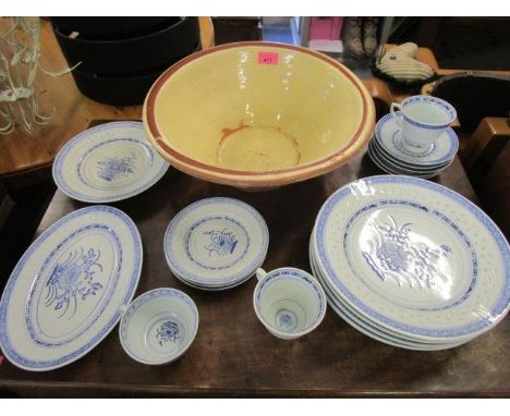 An early 20th century ceramic mixing bowl, along with Chinese green rice bowls, saucers and plates etc 