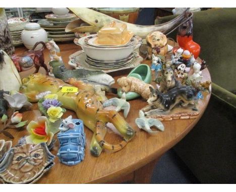 A mixed lot of animal figures to include a bone lamp shaped as a whale and other items 