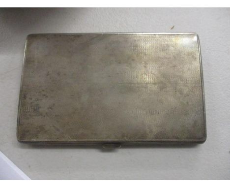 A silver cigarette case with engine turned decoration, 213g 