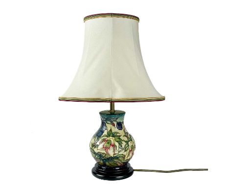 A Moorcroft Pottery Ashwood Hellebore table lamp, by Nicola Slaney. Height including shade 45cm.