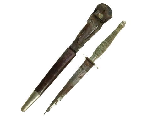 A Fairbairn Sykes first pattern fighting knife. With chequered handle grip slight 'S' oval hilt with leather scabbard and met