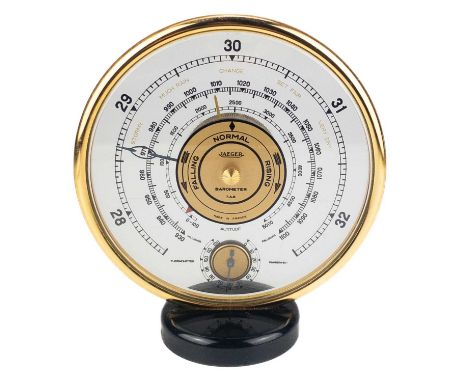 A Jaeger desk top barometer.  Of circular form, diameter 17cm.This barometer appears to be in working order.