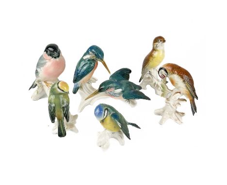A collection of Carlens ceramic birds.  To include a pair of kingfishers, plus five others, the tallest being 14cm.